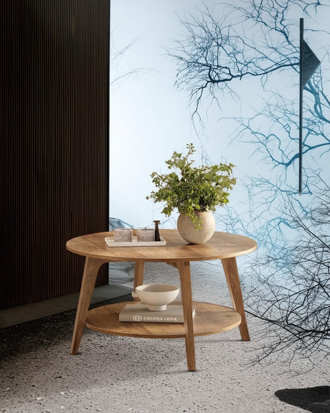 Round center table placed in a styled living room, showcasing its size and Honey Brown color against a sofa.
